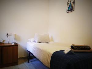 Posteľ alebo postele v izbe v ubytovaní Hostal Casa Nautilus