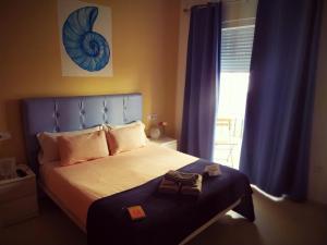 Posteľ alebo postele v izbe v ubytovaní Hostal Casa Nautilus