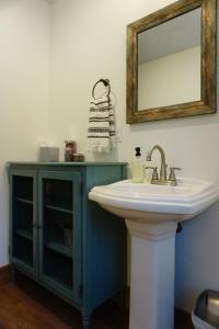 a bathroom with a sink and a mirror at Silver Birch Vacation Rental in Talkeetna