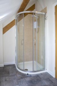 a shower with a glass enclosure in a room at Finest Retreats - 2 Bed Llangollen Cottage - Sleeps 4 in Llangollen +9 photos