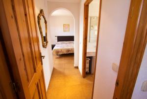 A bed or beds in a room at Club Villamar - Sport