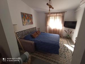 Posteľ alebo postele v izbe v ubytovaní Apartamentos Fuente Nueva II