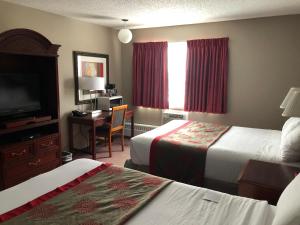 Un pat sau paturi într-o cameră la South Hill Lodge
