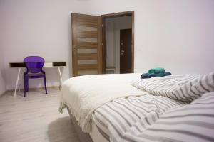 
Łóżko lub łóżka w pokoju w obiekcie Apartament Pułaskiego 9
