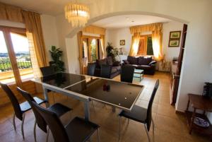 a living room with a table and chairs at Club Villamar - Sport in Calonge