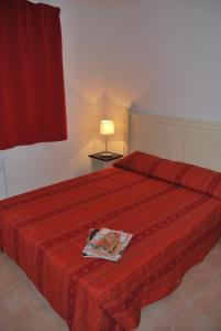 En eller flere senge i et værelse på Lagrange Grand Bleu Vacances – Résidence La Closerie