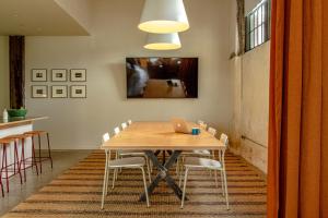 a dining room with a table with a laptop on it at Travelers Hotel in Clarksdale