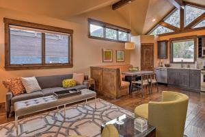 a living room with a couch and a table at Frisco Condo with Rooftop Deck Walk to Main St! in Frisco
