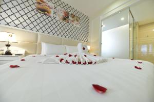 Postel nebo postele na pokoji v ubytování Hanoi HM Boutique Hotel