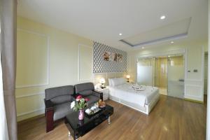 Postel nebo postele na pokoji v ubytování Hanoi HM Boutique Hotel
