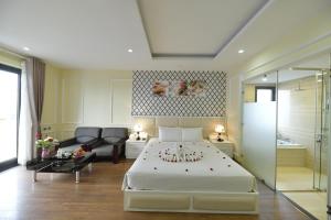 Postel nebo postele na pokoji v ubytování Hanoi HM Boutique Hotel