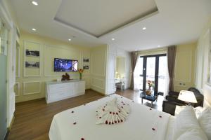 TV a/nebo společenská místnost v ubytování Hanoi HM Boutique Hotel