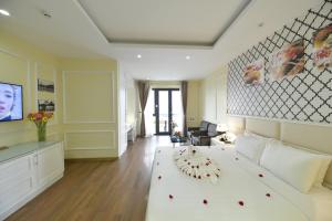Postel nebo postele na pokoji v ubytování Hanoi HM Boutique Hotel