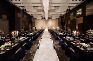 a banquet hall with long tables and chairs at Holiday Inn Incheon Songdo, an IHG Hotel in Incheon