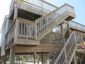 a large wooden tower with stairs on a building at NC 12 56821-37 Condo in Hatteras