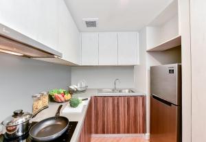 Una cocina o cocineta en Amanta Hotel & Residence Sathorn