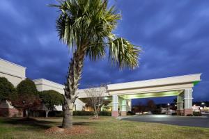 a palm tree in front of a building at Holiday Inn Lumberton, an IHG Hotel in Lumberton