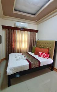 מיטה או מיטות בחדר ב-Piscana Resort