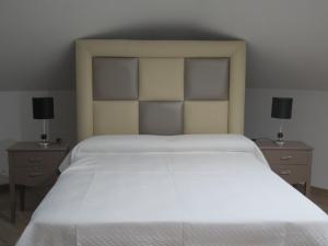 Postel nebo postele na pokoji v ubytování Hotel Restaurante Boabdil