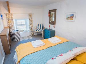 Ένα ή περισσότερα κρεβάτια σε δωμάτιο στο Fern Cottage