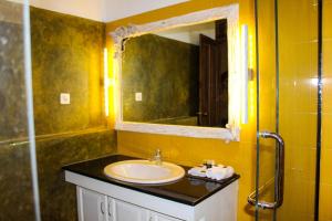 a bathroom with a sink and a mirror at Aayu Lagoon in Negombo +13 photos