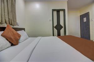 Postel nebo postele na pokoji v ubytování Hotel Sunshine Airport