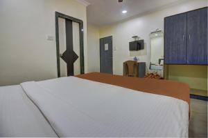 Postel nebo postele na pokoji v ubytování Hotel Sunshine Airport