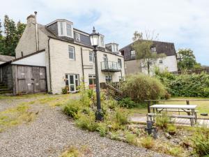 a house with a picnic table in front of it at Cairn View in Arrochar