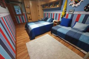Giường trong phòng chung tại Aliga Etxea. Beach & Mountain Village +37 ảnh
