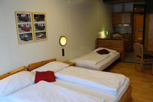 Łóżko lub łóżka w pokoju w obiekcie Hotel Asperner Löwe