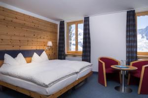 Voodi või voodid majutusasutuse 3100 Kulmhotel Gornergrat toas +32 fotot