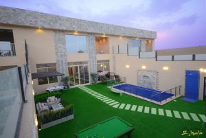 an aerial view of a house with a pool at Masurat Chalet in Riyadh