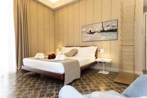 Posteľ alebo postele v izbe v ubytovaní B&B Palazzo Perrotta