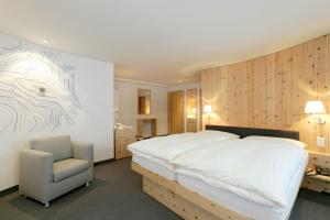 Postel nebo postele na pokoji v ubytování 3100 Kulmhotel Gornergrat