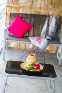 a table with a plate of food on a table at Sea Breeze Vibes in Nea Peramos +34 photos