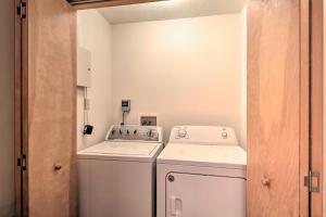a small laundry room with a washer and dryer at Walk to Pool and Lake Albrightsville Vacation Home! in Albrightsville +29 photos