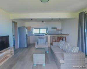Μια τηλεόραση ή/και κέντρο ψυχαγωγίας στο Fullmoon Apartment & Studio
