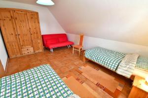 Ein Bett oder Betten in einem Zimmer der Unterkunft Ferienhaus An der alten Waldschänke WS-11a