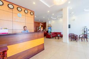 a man standing at the counter of a salon at Galaxy Hotel Phu Quoc in Phu Quoc +82 photos