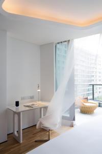 Postel nebo postele na pokoji v ubytování FlyZoo Hotel - Alibaba Future Hotel