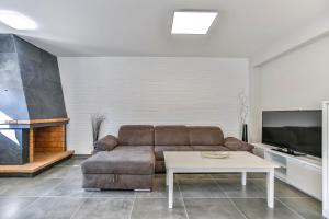 TV a/nebo společenská místnost v ubytování Vacaciones Perfectas en la Playa Calafell