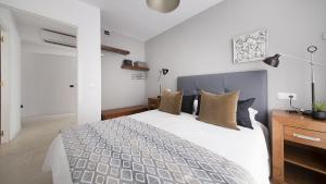 Posteľ alebo postele v izbe v ubytovaní Apartment Unio, TarracoHomes