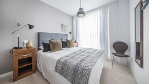 Posteľ alebo postele v izbe v ubytovaní Apartment Unio, TarracoHomes