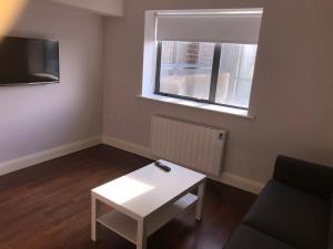 A television and/or entertainment centre at City Centre Apartments in Galway