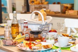 a table topped with food and a basket of bread at Pokoje w Starej Karczmie - by Upstairs in Liszki +183 photos