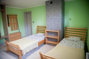 Łóżko lub łóżka w pokoju w obiekcie Sloneczna 10tka