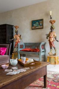 a living room with a couch and a table at Manoir du Mesnil de Bas in Bréhal