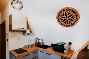 Kuchyňa alebo kuchynka v ubytovaní Apartamenty Oliwia