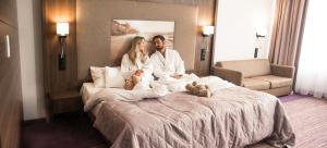 Postel nebo postele na pokoji v ubytování Hotel Lidia Spa & Wellness
