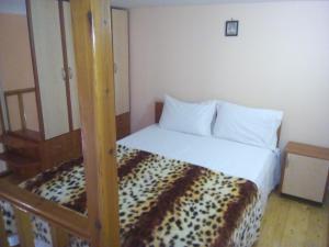Postel nebo postele na pokoji v ubytování Kimi apartments